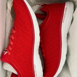 Selling red APL sneakers. Never been worn.